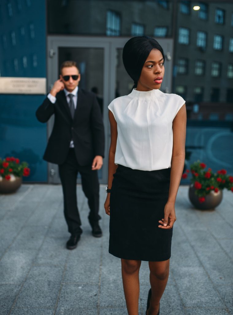 business-woman-bodyguard-in-suit-on-background.jpg