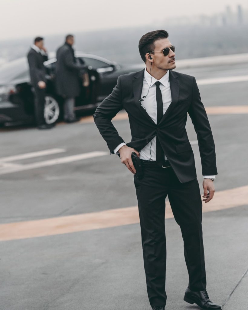 handsome-bodyguard-with-security-earpiece-and-gun.jpg